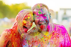 Guys with a girl celebrate holi festival