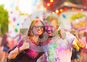 Guys with a girl celebrate holi festival