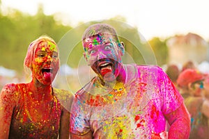 Guys with a girl celebrate holi festival