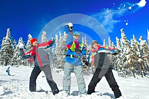 Guys having snowball fight