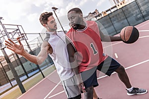 Guys playing basketball