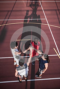 Guys playing basketball