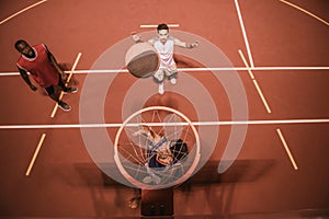 Guys playing basketball