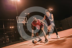 Guys playing basketball