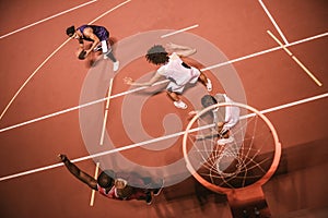 Guys playing basketball