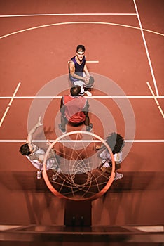 Guys playing basketball