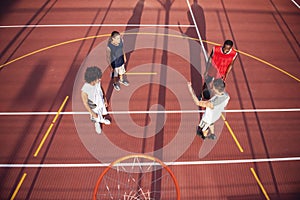 Guys playing basketball