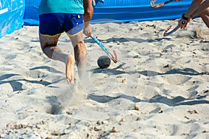 Guys Playing Beach Hokey on Official Competition in Summer on the Sand