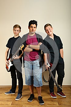 Guys posing with electric guitars