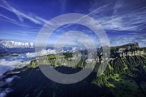 GView of Lake Thun and Bernese Alps including Jungfrau, Eiger and Monch peaks from the top of Niederhorn in summer, Switzerland