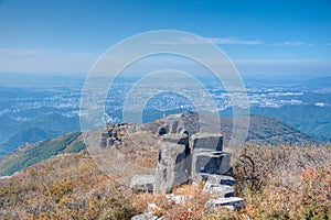 Gwangju viewed behind rocks of Jusangjeolli Cliff at Mudeungsan Mountain, Republic of Korea