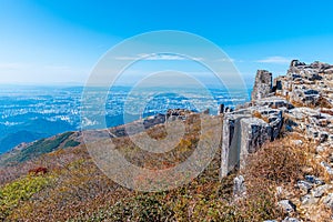 Gwangju viewed behind rocks of Jusangjeolli Cliff at Mudeungsan Mountain, Republic of Korea