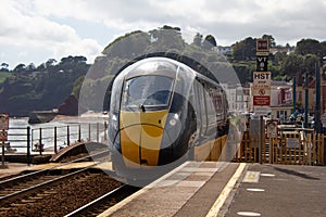 A GWR train passes through Dawlish railway station in Devon