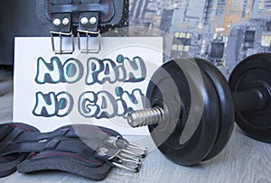 Gym dumbbell, belts, kettlebell with motivational poster no pain no gain for active workouts at hom Home workouts