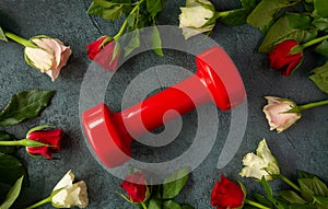 Gym dumbbell and roses for Valentine\'s Day, flat lay composition.