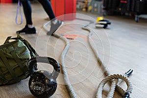 Gym equipment for boot camp and work out. Kettle Bell, Rope, Sandbag in gym hall