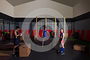 Gym group workout barbells slam balls and jump