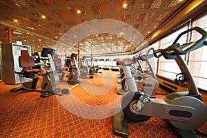 Gym hall with exercise bicycle in cruise ship