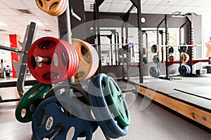 Gym interior with weight plates close up