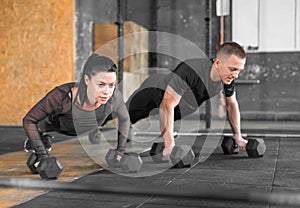 Gym man and woman push-up. Strength pushup, Workout.