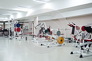 gym modern fitness center room. empty hall with simulators on different muscles.