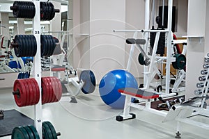 gym modern fitness center room. empty hall with simulators on different muscles.