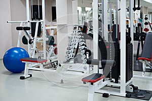 gym modern fitness center room. empty hall with simulators on different muscles.