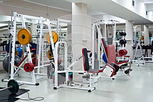 gym modern fitness center room. empty hall with simulators on different muscles.