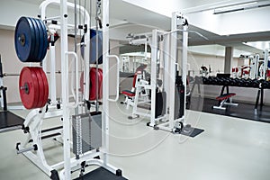 gym modern fitness center room. empty hall with simulators on different muscles.