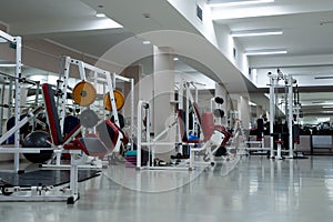 gym modern fitness center room. empty hall with simulators on different muscles.