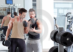 Gym personal trainer man with weight training
