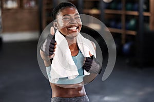 Gym, portrait or happy black woman with thumbs up in fitness training with positive mindset or motivation. Encouragement