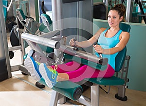 Gym seated leg curl machine exercise woman