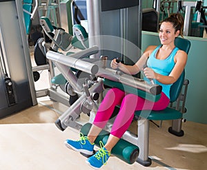 Gym seated leg curl machine exercise woman