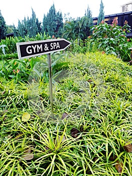 Gym & Spa signboard, tropical resort