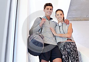 Gym time. a sporty young couple on their way to the gym together.