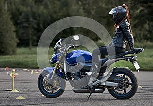 Gymkhana training day. Girl trainings ride motocycle photo