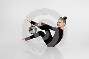 gymnast doing an exercise with mirror bal