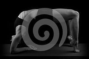 Gymnast elbows toes backward bend b&w