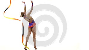 Gymnast gracefully move with a ribbon in his hands. White background