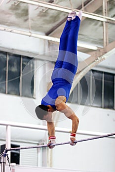 Gymnast on high bar