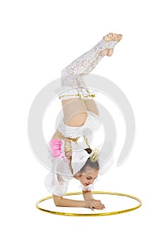 Gymnast standing twirling a hula hoop