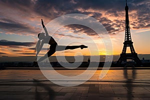 Gymnast stretching at sunset by the Eiffel Tower