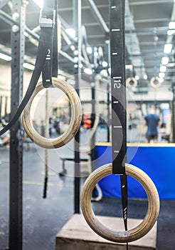 Gymnastic rings in the crossfit zone in the gym