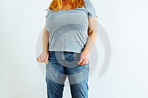 Gynecologic problems, urinary incontinence, female health. Woman showing off wet jeans