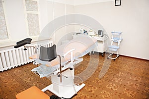 Gynecological chair in the clinic for artificial insemination and reproduction of women. Couch and medical equipment for