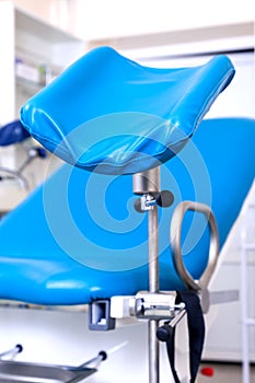 Gynecological room gynecologist chair equipment tool blue white clinic hospital