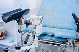 Gynecological surgery room with chair and equipment. Medical and Healthcare concept. Selective focus