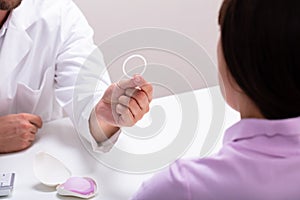 Gynecologist Consulting Woman On Contraception Ring photo