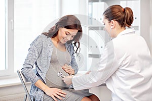 Gynecologist doctor and pregnant woman at hospital